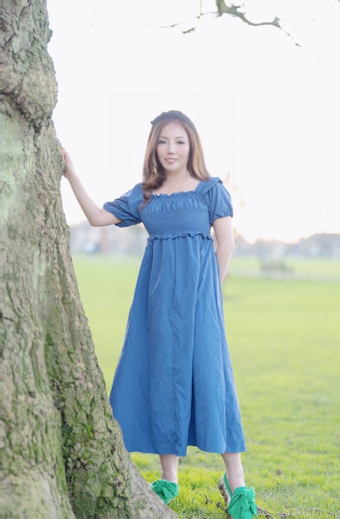 Etsuko Elite South Korean Escort against a tree