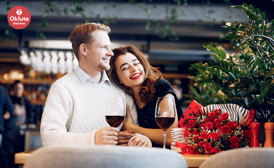 Couple dining with roses and red wine