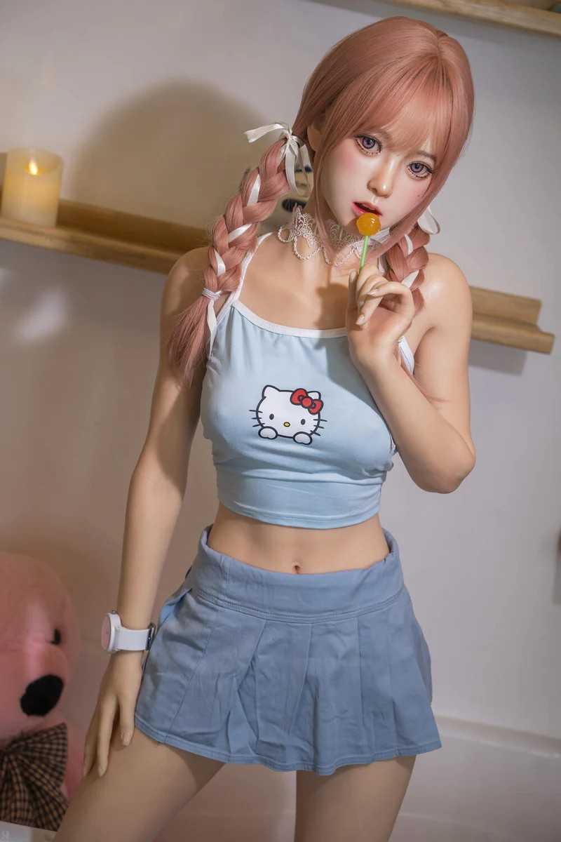 Fantasy Sex Doll sucking on a lolly pop